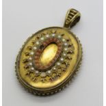 Victorian yellow metal locket set with split pearls and coral, with engraved monogram to reverse and