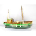 A remote controlled wooden model fishing boat, “Albatross”, 71cm long with a remote control hand