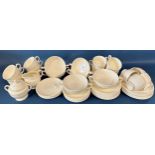 A collection of Wedgwood cream ground tableware comprising tea cups, saucers, open soup bowls, etc