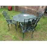 A dark green painted cast alloy five piece garden terrace set comprising a circular top table, and