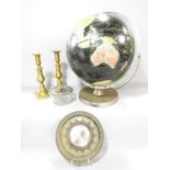 An Encyclopaedia Brittanica Globe on a rotating axis, together with a pair of brass candlesticks and