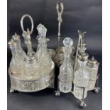 An Victorian silver plated revolving vinaigrette stand with six bottles and a central loop handle,