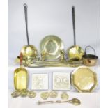 A collection of highly polished antique brassware including a set of weights, coal shovel,