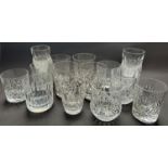 A good selection of cut glass drinking glasses including champagnes, tumblers, etc, silver plated