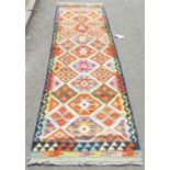 A Chobi Kilim runner, with repeating row of multicoloured diamonds, 247 x 81cm approx.