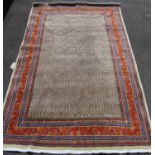 Persian Rug with intricate boteh design surrounded by multiple borders in vibrant tones of blue,