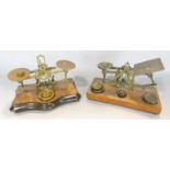 A Victorian postal scale and another scale, both with a selection of weights
