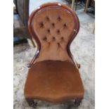 A Victorian mahogany drawing room chair with moulded show wood frame and serpentine seat