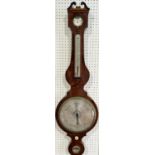 A large Georgian mahogany wheel barometer with silvered dials, by Woller of London