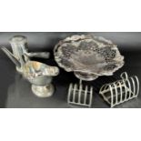 A Georgian style silver plate chocolate pot, a Victorian silver plated fruit basket, two toast racks