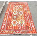 A Chobi Kilim, with two rows of diamonds to the central panel, 183 x 123cm approx