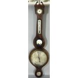 A Georgian mahogany wheel barometer with silvered dials, the case with string inlaid borders,