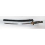 A Japanese Wakizashi short sword in a black lacquered scabbard and ray skin grip bound with black