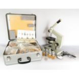 A Portable Student Biological Microscope made in the USSR, together with a selection of lenses and