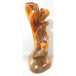 A modern wood sculpture entitled “Genesis” signed and dated on the base Tim Earl ‘98, 58cm high.