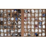 A collection of mother of pearl and shell buttons, mainly 19th century including sew through and