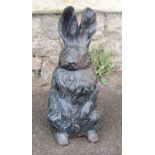 A vintage cast iron novelty garden or interior ornament in the form of a seated rabbit, 43cm high