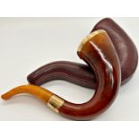 A good quality antique smoking pipe with simulated amber bodywork, with 9ct gold rim and feral, with