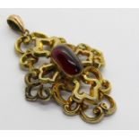 Victorian yellow metal mourning pendant set with a cabochon garnet, containing a lock of hair to