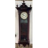 A Vienna style regulator wall clock with enamelled dial, with twin brass weight driven movement, the