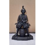 A novelty cast iron "Old Tom Don't u Tell" Jester door porter, 43 cm high