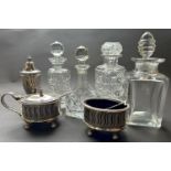 A collection of toilet water bottles and stoppers, silver plated condiments