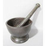 A 19th century simple cast iron pestle and mortar, 11.5cm diameter