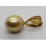 18ct golden pearl pendant set with diamonds, probably a South Sea pearl 3.1cm L approx, 6g