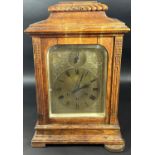 A late 19th century bracket clock with engraved brass dial, silent/chime selector and three train