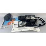 Photographic equipment: A Minolta XG1 camera, a Tomkins lens and a Minolta flash gun
