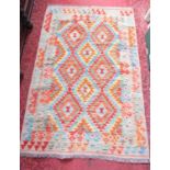 A Chobi Kilim with a multicoloured all over geometric pattern, 153 x 103cm approx.