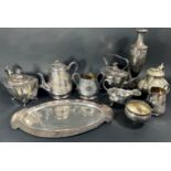 Two silver plated teapots, a Georgian style silver plated sauce boat, a plated serving dish, a