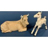 Two Crown Derby Imari cats both with silver stoppers and a Nao recumbent cow, Beswick foal, a