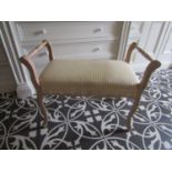 A French stool with limed beechwood framework, an upholstered seat on shaped support, together