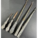 A small silver collection of button hooks, nail file and a cuticle tool, together with six silver