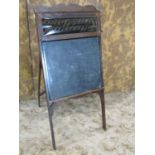 A late 19th century American child's folding easel enclosing a blackboard, the upper panel showing