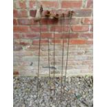 Four weathered steel ornamental flower garden border stakes, together with one other (5) 104cm high