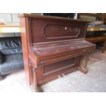 A Rudibach & Son upright iron frame overstrung piano in mahogany case