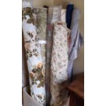 10 roll/part rolls of upholstery fabric including a woven floral design on ivory ground, and a
