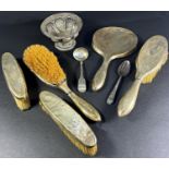 Two silver hairbrushes, two clothes brushes, a hand mirror and two spoons and an Indian silver