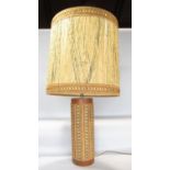 A retro table lamp c.1960s teak and fibre glass with a crochet string covering and matching shade,