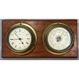A mahogany board mounted with a Metamec quartz movement marine bulkhead clock and a matching