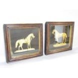 A pair of Regency bas relief gilded horses in painted simulated wood effect frames, 37cm x 35cm