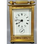 A good quality contemporary French carriage clock, the eleven jewel movement with strike action