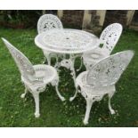 A painted cast aluminium garden terrace table of circular form with decorative pierced detail,