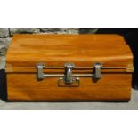An antique steel travelling trunk with original wood grained finish and chrome mounts