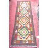 A Maimana Kilim runner, with diamond and stepped diamonds on a navy ground ,196 x 67cm approx.