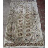 A Turkoman Rug with two central rows of elephant foot design, in natural wool tones, 160 x 97 cm