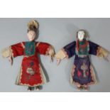 Two early 20th century Chinese 'Opera' dolls, with long puppet-style hands, wearing traditional