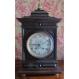 A mid Victorian period bracket clock with silvered dial and eight day striking movement